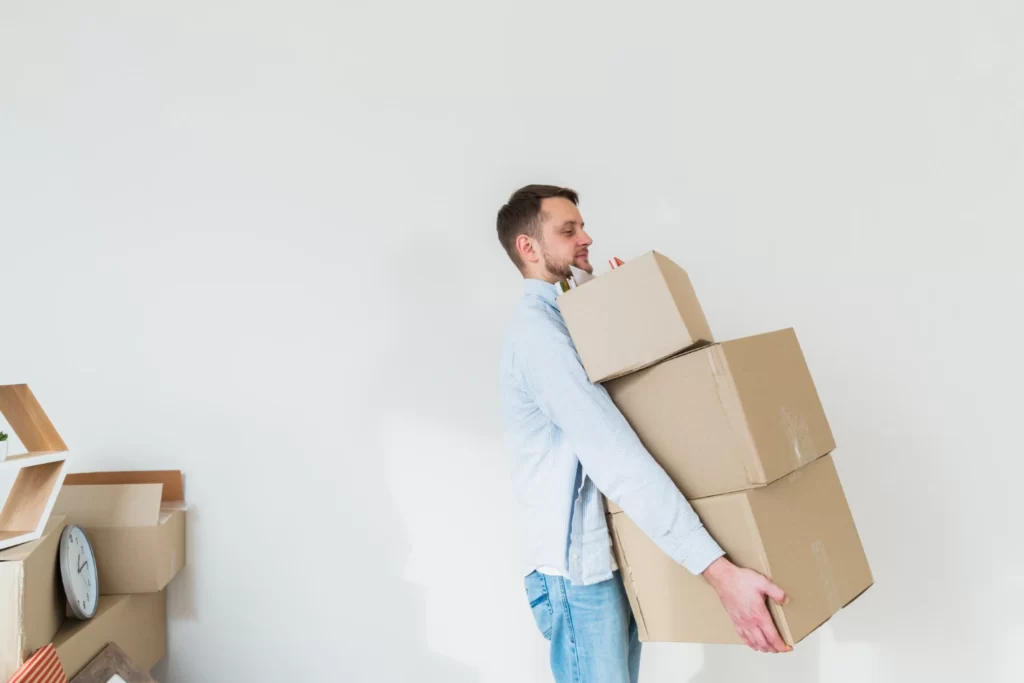 Man carrying boxes moving in or out